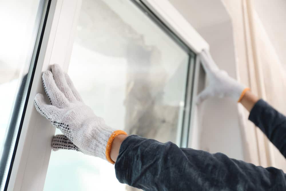 Worker Installing Plastic Window Indoors Closeup View
