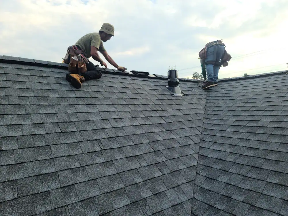 Bay Area Exteriors worker ensuring roof durability with expert repairs on a home rooftop in Talbot County, MD, providing trusted roofing solutions
